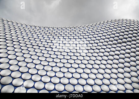 Modern landmark architecture of the Selfridges Building in Birmingham, United Kingdom. The building is part of the Bullring Shopping Centre and houses Selfridges Department Store. The building was completed in 2003 at a cost of £60 million and designed by architecture firm Future Systems. It has a steel framework with sprayed concrete facade. Since its construction, the building has become an iconic architectural landmark and seen as a major contribution to the regeneration of Birmingham. Stock Photo