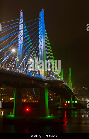 Tilikum Crossing, a new lightrail, bike, and pedestrian bridge in Portland, Oregon lit up at night. USA