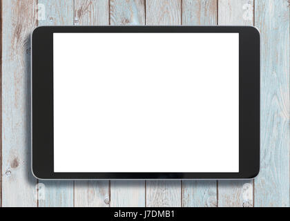 Black tablet pc looking similar to ipad on old white wood background Stock Photo