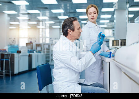 Very attentive technician working in the laboratory Stock Photo