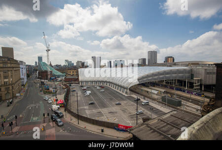 A general view of the Manchester Arena (right), Victoria railway station and a closed Corporation Street after a suicide bomber killed 22 people leaving a pop concert at the venue on Monday night. Stock Photo