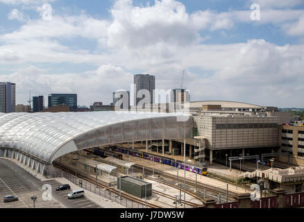 A general view of the Manchester Arena (right) and Victoria railway station after a suicide bomber killed 22 people leaving a pop concert at the venue on Monday night. Stock Photo