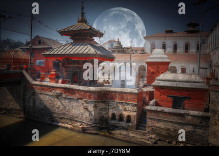moon. Votive temples and shrines in a row at Pashupatinath Temple, Kathmandu, Nepal. Stock Photo