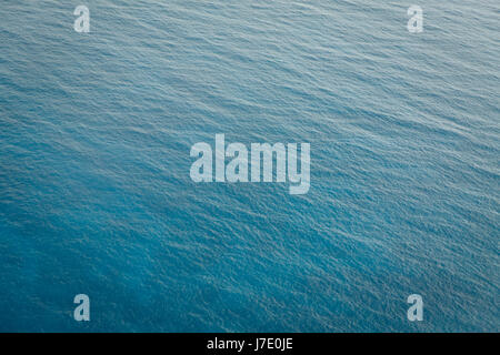 ariel view of british virgin island waters in the caribbean with a turquoise grandient and ripples of waves Stock Photo