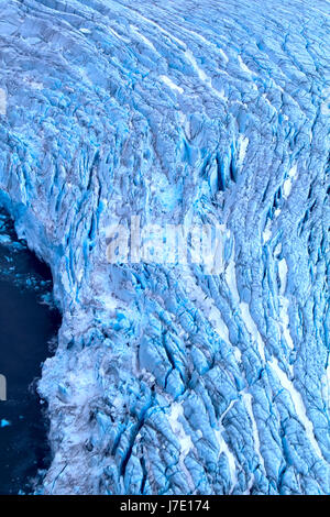 Harsh glaciers of Arctic. Live glacier: front wall and ablation zone (production of small icebergs and growlers). Novaya Zemlya archipelago, North isl Stock Photo