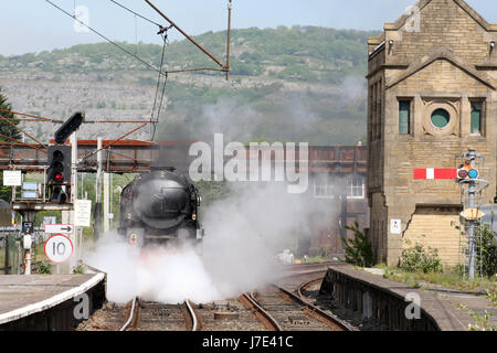 Merchant Navy class steam locomotive British India Line in black livery approaching Carnforth station as it prepares to do a test run to Hellifield. Stock Photo