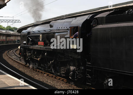 Merchant Navy class steam locomotive British India Line in black livery in Carnforth station as it prepares to do a test run to Hellifield. Stock Photo