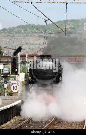 Merchant Navy class steam locomotive British India Line in black livery approaching Carnforth station as it prepares to do a test run to Hellifield. Stock Photo