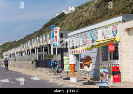 Promenade beach huts and The Prom Diner, Boscombe, Bournemouth, Dorset, England, United Kingdom Stock Photo