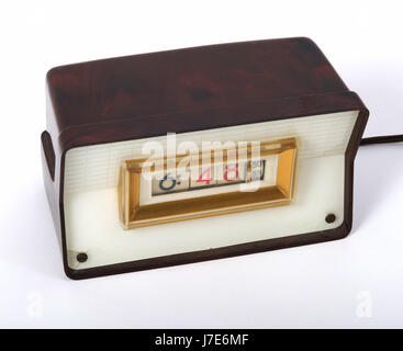 Vintage 1950's electric digital clock with bakelite cabinet. Stock Photo