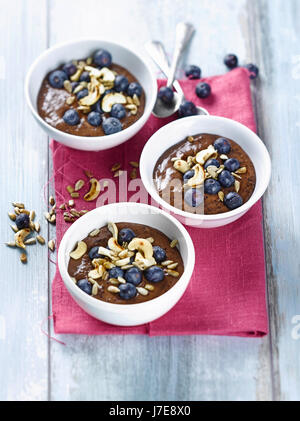 Blueberry smoothie bowl with plums Stock Photo