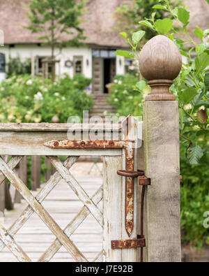 Rusty metal on gate latch of 17th century famhouse Stock Photo