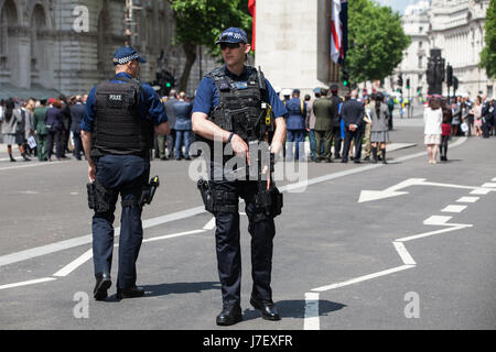 London, UK. 24th May, 2017. Armed police watch over the memorial service at the Cenotaph in Whitehall on the International Day of UN Peacekeepers in remembrance of those who have lost their lives in the service of peace since UN peace operations began in 1948. Credit: Mark Kerrison/Alamy Live News Stock Photo