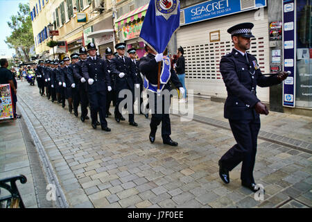 Gibraltar. 24th May 2017. Royal Gibraltar Police recruits today paraded through Main Street onto Casemates Square under tight armed security. The Police Passing Out parade continued as normal with the British Overseas Territory keeping their security levels at Substantial and not paralleling the UK’s Critical security status. The parade was supported by Armed Response Units from both the RGP and GDP along with AFO officers, police dog units and search teams to ensure tight security measures were in place throughout the event. Credit: Stephen Ignacio/Alamy Live News Stock Photo