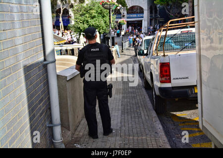 Gibraltar. 24th May 2017. Royal Gibraltar Police recruits today paraded through Main Street onto Casemates Square under tight armed security. The Police Passing Out parade continued as normal with the British Overseas Territory keeping their security levels at Substantial and not paralleling the UK’s Critical security status. The parade was supported by Armed Response Units from both the RGP and GDP along with AFO officers, police dog units and search teams to ensure tight security measures were in place throughout the event. Credit: Stephen Ignacio/Alamy Live News Stock Photo