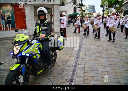 Gibraltar. 24th May 2017. Royal Gibraltar Police recruits today paraded through Main Street onto Casemates Square under tight armed security. The Police Passing Out parade continued as normal with the British Overseas Territory keeping their security levels at Substantial and not paralleling the UK’s Critical security status. The parade was supported by Armed Response Units from both the RGP and GDP along with AFO officers, police dog units and search teams to ensure tight security measures were in place throughout the event. Credit: Stephen Ignacio/Alamy Live News Stock Photo