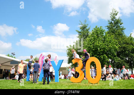 Hay Festival 2017 - Hay on Wye, Wales, UK - May 2017 - Local school children enjoy the  opening day of this years Hay Festival which celebrates its 30th anniversary in 2017. The iconic giant HAY letters have been amended to reflect this. Credit: Steven May/Alamy Live News Stock Photo