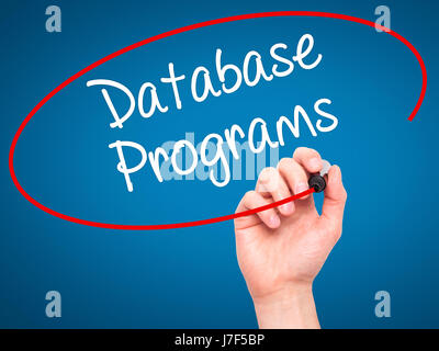 Man Hand writing Database Programs with black marker on visual screen. Isolated on background. Business, technology, internet concept. Stock Photo Stock Photo