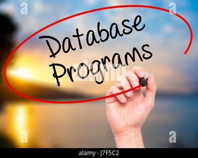 Man Hand writing Database Programs with black marker on visual screen. Isolated on background. Business, technology, internet concept. Stock Photo Stock Photo