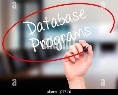 Man Hand writing Database Programs with black marker on visual screen. Isolated on background. Business, technology, internet concept. Stock Photo Stock Photo