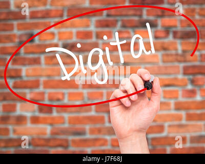 Man Hand writing Digital with black marker on visual screen. Isolated on background. Business, technology, internet concept. Stock Photo Stock Photo