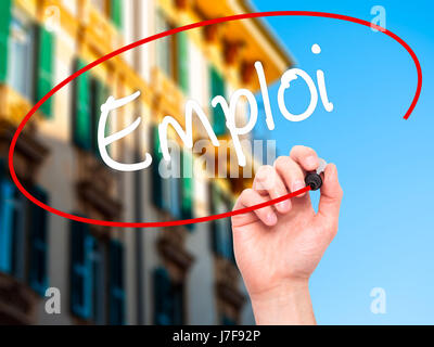 Man Hand writing Emploi (Employment in French) with black marker on visual screen. Isolated on background. Business, technology, internet concept. Sto Stock Photo