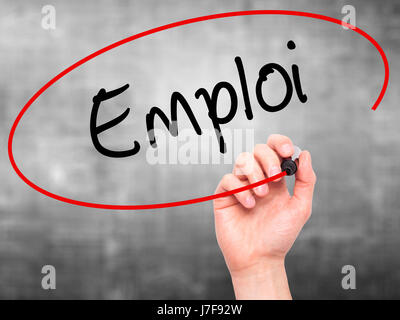 Man Hand writing Emploi (Employment in French) with black marker on visual screen. Isolated on background. Business, technology, internet concept. Sto Stock Photo