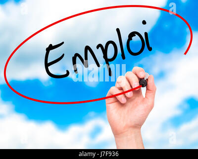 Man Hand writing Emploi (Employment in French) with black marker on visual screen. Isolated on background. Business, technology, internet concept. Sto Stock Photo