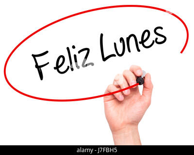 Man Hand writing Feliz Lunes (Happy Monday In Spanish) with black marker on visual screen. Isolated on white. Business, technology, internet concept.  Stock Photo