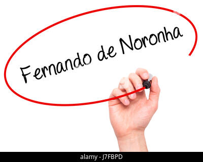 Man Hand writing Fernando de Noronha with black marker on visual screen. Isolated on white. Business, technology, internet concept. Stock Photo Stock Photo