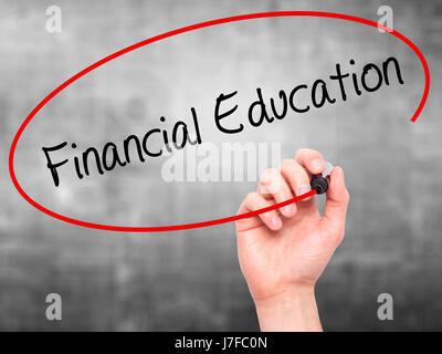 Man Hand writing  Financial Education with black marker on visual screen. Isolated on grey. Business, technology, internet concept. Stock Photo Stock Photo