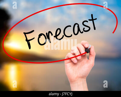 Man Hand writing Forecast with black marker on visual screen. Isolated on nature. Business, technology, internet concept. Stock Photo Stock Photo