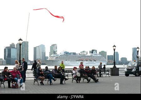 The esplanade in Battery Park City before a dance performance with the cruise ship, Crystal Symphony on its way down the Hudson River. May 20, 2017 Stock Photo