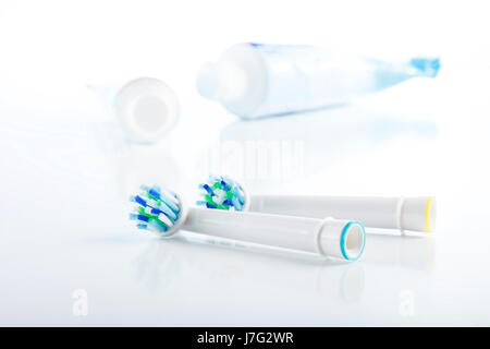 Oral hygiene accessory isolated on white background, toothpaste, toothbrush head Stock Photo