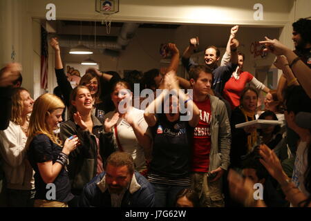 Volunteers cheer at Barack Obama's headquarters in Bloomington, Indiana on November 4, 2008 - election night - as television news announces a small lead for Obama again McCain at the moment in this photograph. Stock Photo