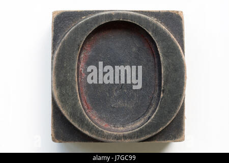 Old letter O letterpress printing block isolated on a white background Stock Photo