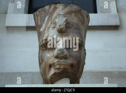 Colossal head of Egyptian pharaoh Amenhotep III. 18th Dynasty, 1400 BC. Thebes. British Museum. London. GBR Stock Photo