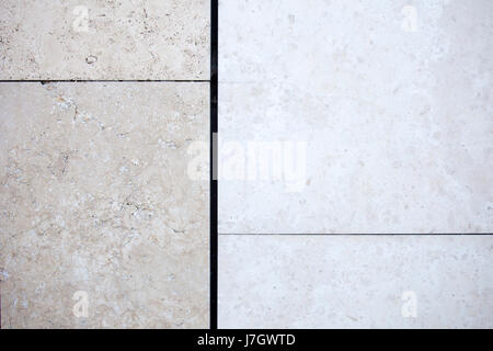 Beige travertine decorative tiles on a wall Stock Photo