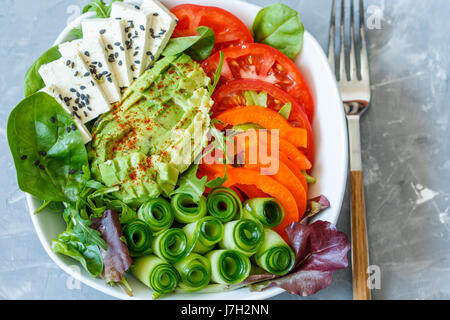 Colorful summer vegan salad with tofu and vegetables. Love for a healthy vegan food concept Stock Photo