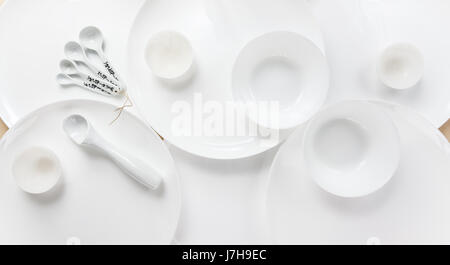 Empty white plates of different sizes for the whole background Stock Photo