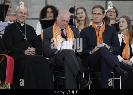 Berlin, Germany. 24th May, 2017. Justin Welby, the Archbishop of Canterbury, Norbert Lammert, the President of the Bundestag, and Michael Muller, the Governing Mayor of Berlin, are pictured from left to right at the stage during the opening service. Representatives of Politics and other Christian denominations addressed the opening service of the 36th German Protestant Church Congress in Berlin. The congress coincides with the 500. anniversary of the Reformation. Credit: Michael Debets/Pacific Press/Alamy Live News Stock Photo