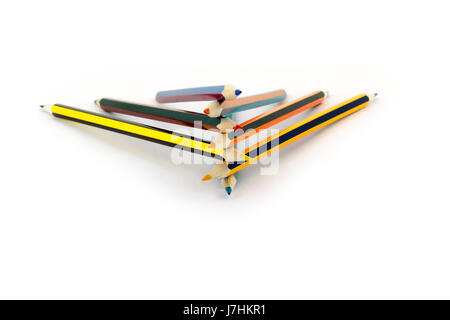 Colored pencils lie on top of each other isolated on white background Stock Photo