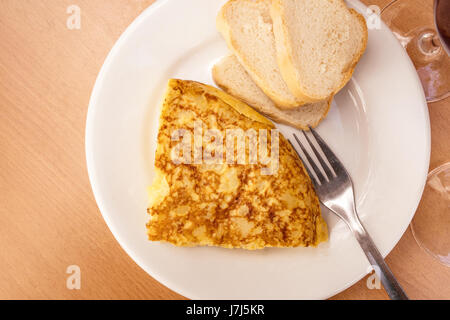 Spanish tortilla with wine, tapas in bar, with copyspace Stock Photo
