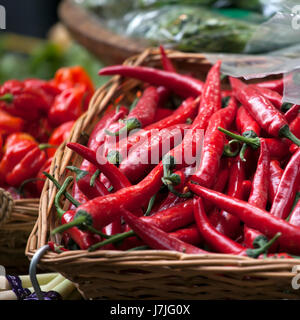 Basket of red chili peppers on the Borough market in London Stock Photo