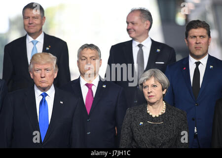 US President Donald Trump (front left) and Prime Minister Theresa May (fronT right) during the North Atlantic Treaty Organisation (NATO) summit in Brussels. Stock Photo