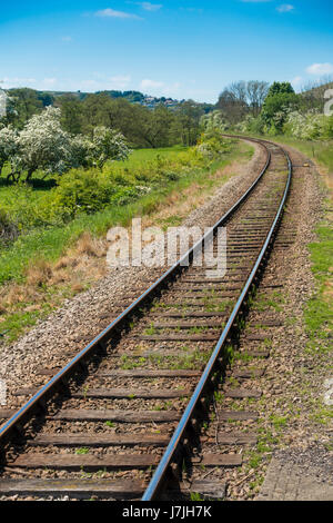 A single track, rural standard gauge railway line on a curve in open country Stock Photo