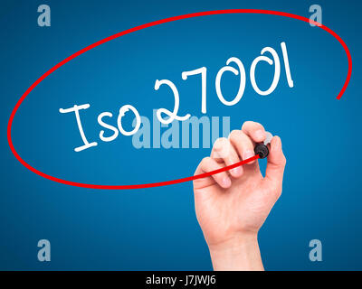 Man Hand writing Iso 27001  with black marker on visual screen. Isolated on blue. Business, technology, internet concept. Stock Photo Stock Photo