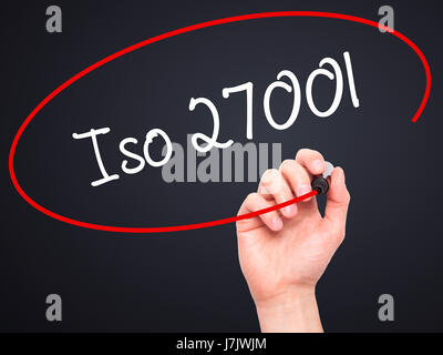 Man Hand writing Iso 27001  with black marker on visual screen. Isolated on black. Business, technology, internet concept. Stock Photo Stock Photo