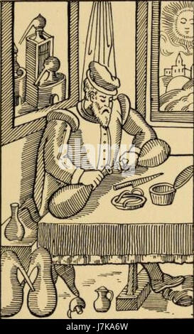 The image or title refers to an alchemist engaged in their work, possibly referencing historical practices of alchemy, a precursor to modern chemistry, blending mysticism and early scientific methods. Stock Photo