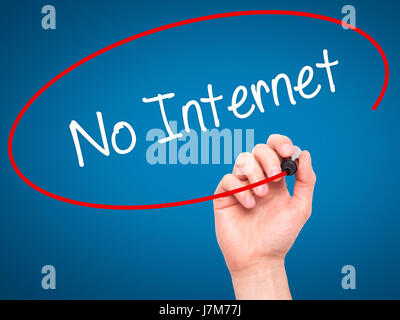 Man Hand writing No Internet with black marker on visual screen. Isolated on blue. Business, technology, internet concept. Stock Photo
